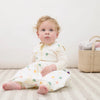 Baby wearing ClevaMama Mushroom DreamSuit sitting comfortably in breathable Australian cotton